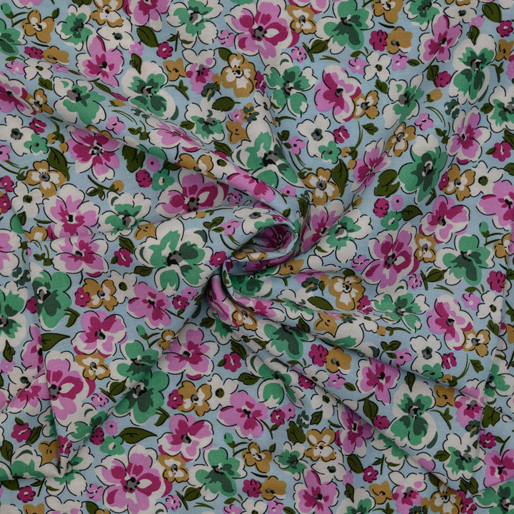 Wiskoza Drukowana Wiosenna Pastelowa Łąka na Błękitnym Tle - Textil World